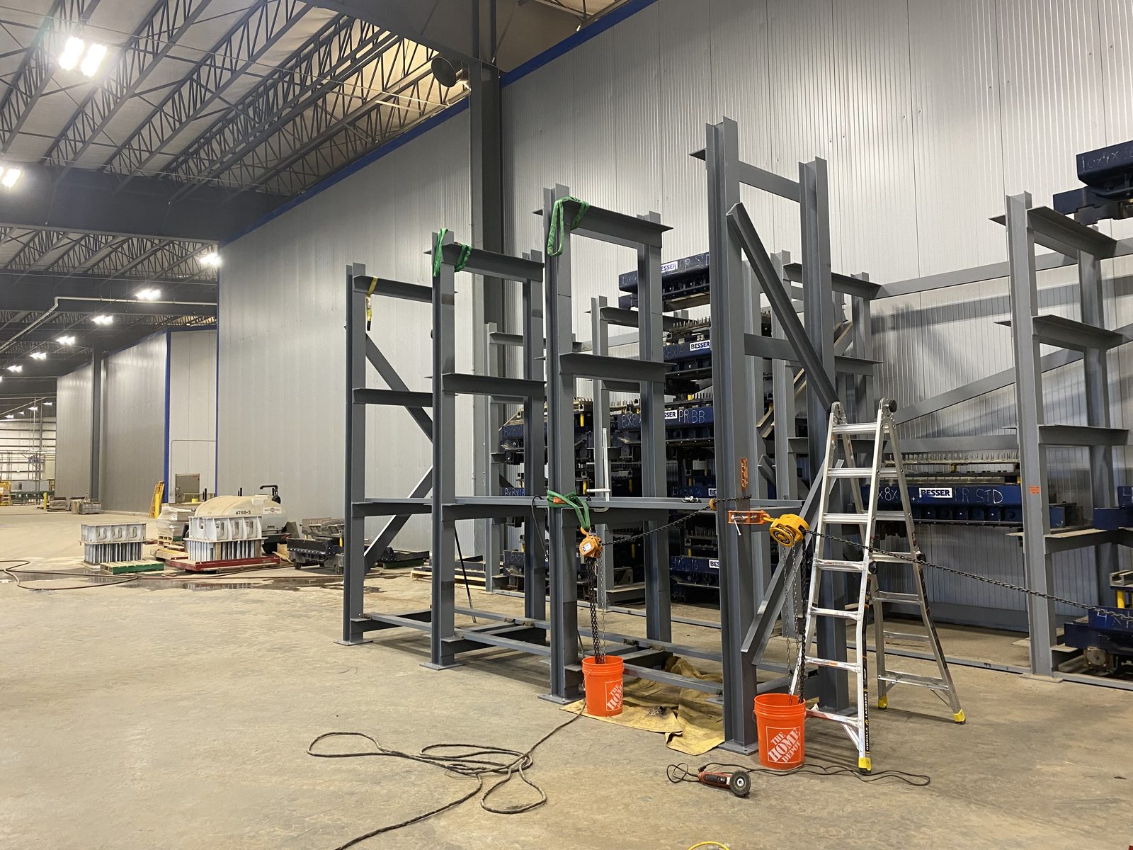 Custom steel storage rack for masonry forms, too large to ship assembled, fabricated and welded onsite by Conrad